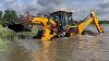 A Backhoe Carrying Out Dangerous Work In A River Droneplanet2040